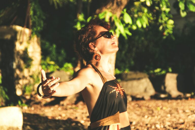 Woman performing active breathing exercises outdoors